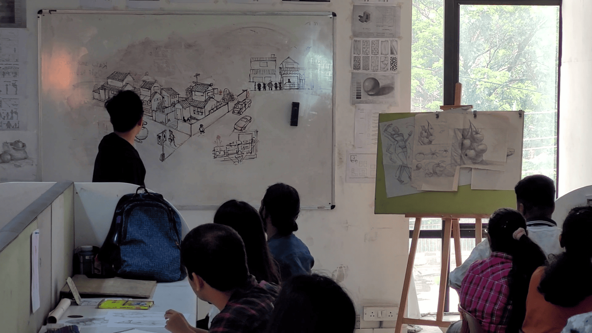 Lecturer Peter Sir teaching students - Animaster Design College